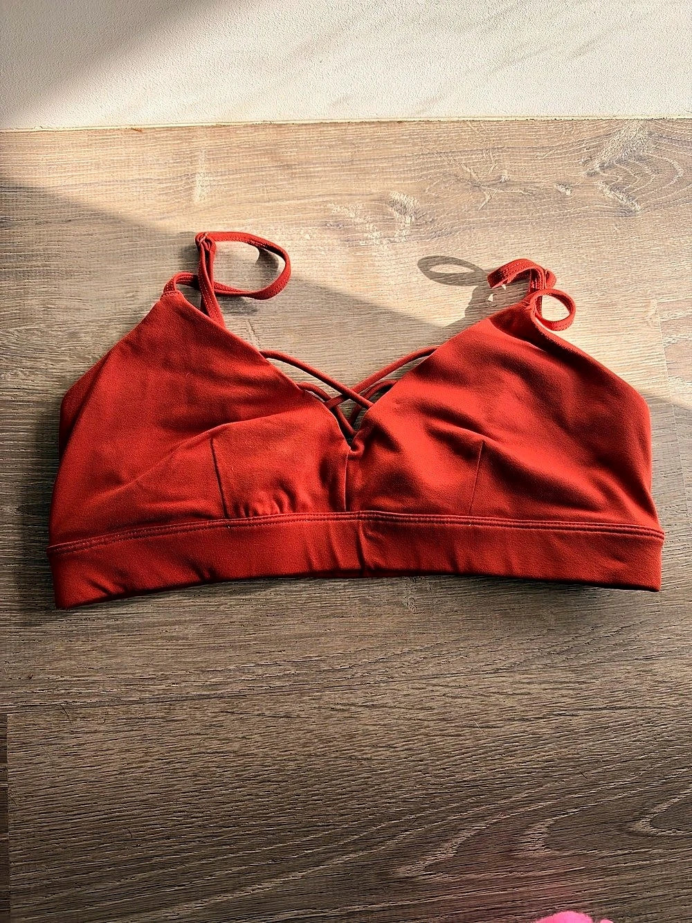 Alo Yoga Airlift Divine Bra in a beautiful warm rust red/terracotta shade, size